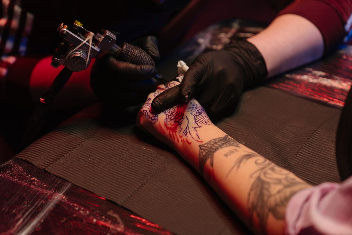 Forearm panel under light — Eli Sato